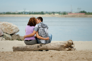 Loving couple is kissing at sea beach