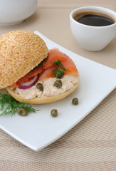 Salmon sandwich and a cup of coffee
