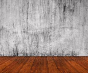 Wooden floor with concrete wall