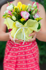 Florist hands showing bouquet flowers shop market