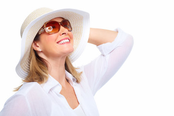 Woman wearing sunglasses and a hat.