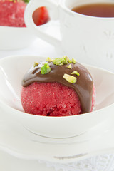 Strawberry sorbet with chocolate and pistachios.