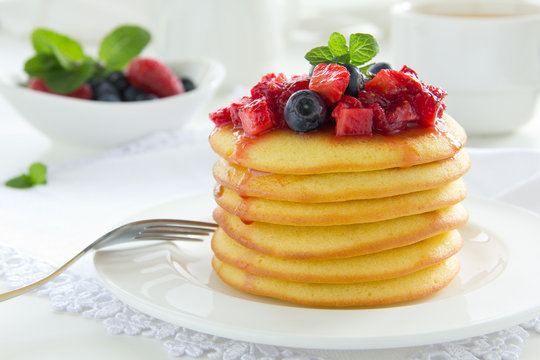 Pancakes with summer berries: strawberries, blueberries.