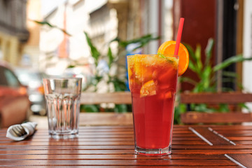 Refreshing lemonade on wooden table