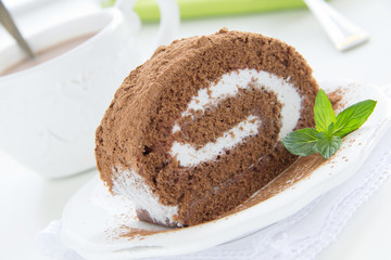 Chocolate roll with cream.