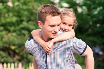Fototapeta premium Happy father and daughter playing in the park
