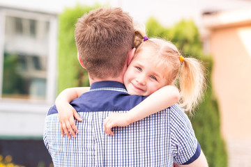 Happy father and daughter playing in the park