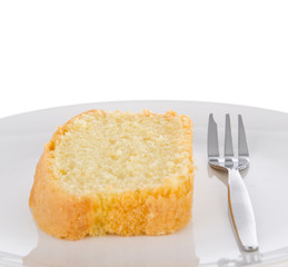 Slice of fresh homemade butter cake on a plate