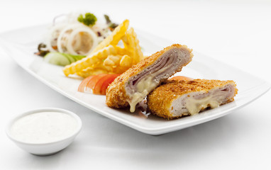 Pork cordon bleu with french fries.