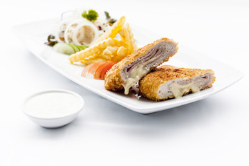 Pork cordon bleu with french fries.