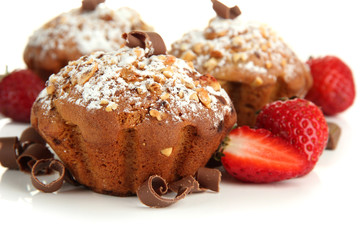 Tasty muffin cakes with strawberries and chocolate, isolated