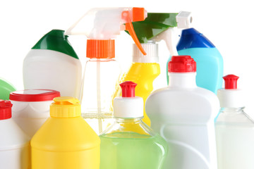 Different kinds of house cleaners and colorful sponges, gloves