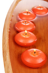 Beautiful candles in water close-up