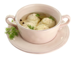 Tasty khinkali in .saucepan, isolated on white