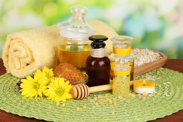 Fragrant honey spa with oils and honey on wooden table close-up