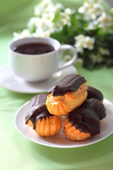 Eclairs with cream in chocolate coating