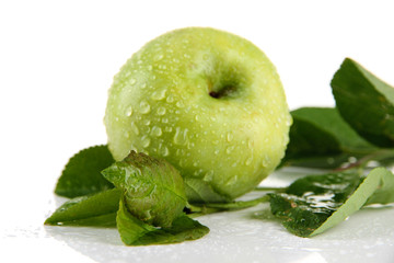 Juicy green apple with leaves, isolated on white