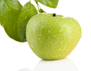 Juicy green apple with leaves, isolated on white