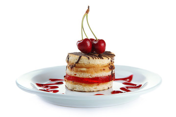 Tasty biscuit cake on plate isolated on white
