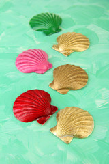 Colorful seashells on color wooden background