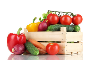 Fresh vegetables in wooden box on white background