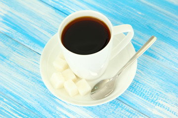 Cup of coffee, on color wooden background
