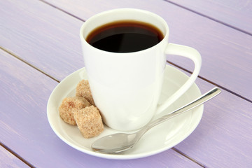 Cup of coffee, on color wooden background
