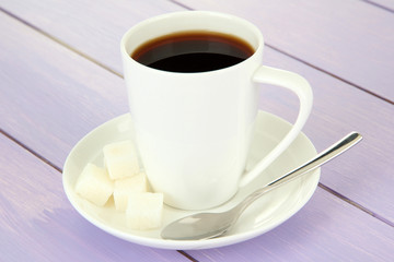 Cup of coffee, on color wooden background