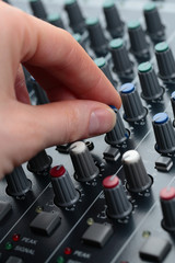 Naklejka premium Hand Tuning Audio Mixer