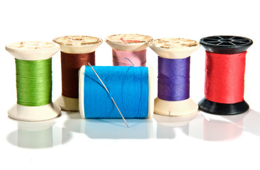 old Spool of thread and needle