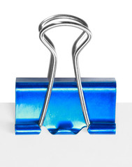 Close up of a blue binder clip
