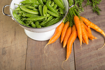 Fresh green peas and carrots