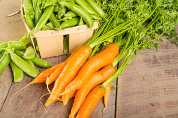 Fresh green peas and carrots
