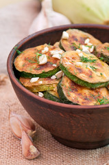 Fried zucchini in an old ceramic bowl