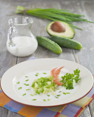 Cold soup with shrimp. avocado and cucumber