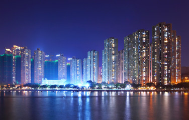 Fototapeta na wymiar Apartment building in Hong Kong at night