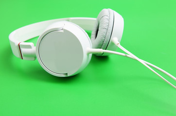 Headphone over green background