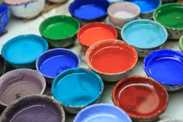Fototapeta premium water-color in a cup for painting a porcelain
