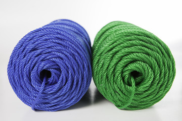 Rolls of green and blue polyester rope - close up