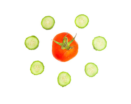 Red tomato encircled with cucumber slices