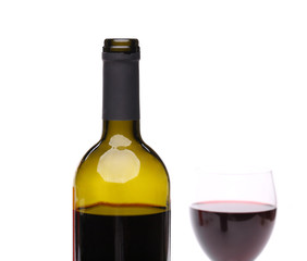 A bottle of red wine with a wine glass.
