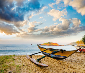 fishing boat  against sunset background