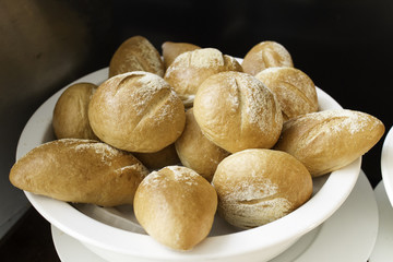 Fresh baguette in white bowl