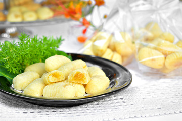 worm cookies on a black dish