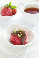 Strawberry sorbet with chocolate and pistachios.