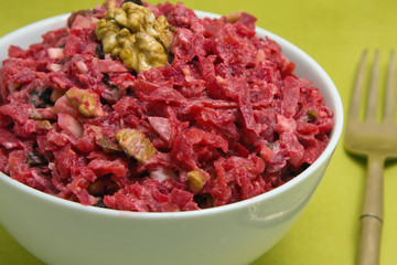 Salad with beets, dried plums, nuts
