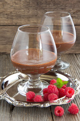 Chocolate mousse with raspberries.