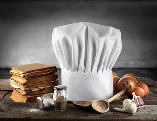 cooking books and white cap