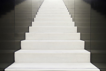 Fototapeta na wymiar Concrete stairs with black wall