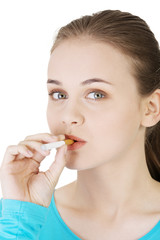 Naklejka premium Young woman smoking electronic cigarette (ecigarette)